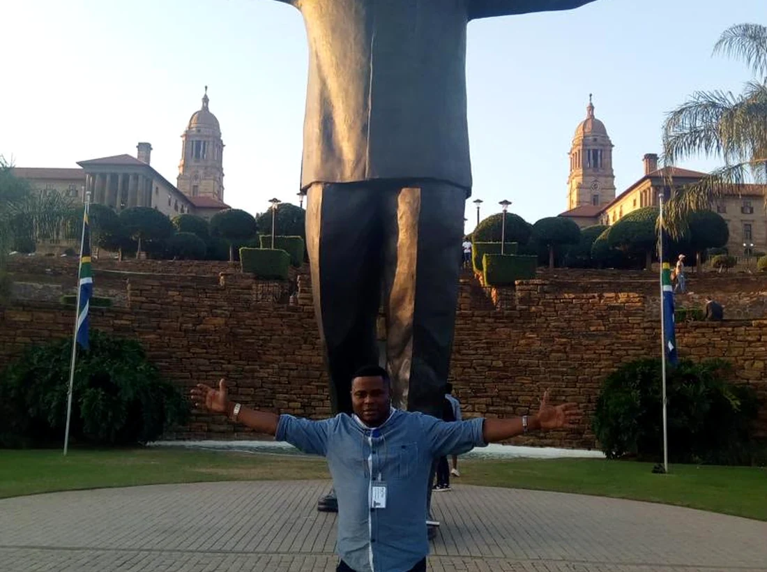 MKNIX Travel representative visiting the Nelson Mandela statue in South Africa