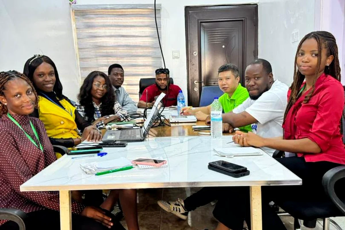 MKNIX Travel team in an office meeting